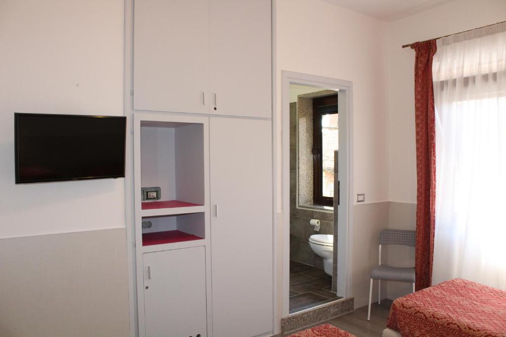 TV a/nebo společenská místnost v ubytování Alla Bianca Hotel