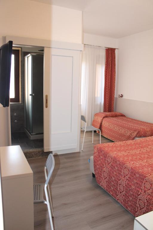 Postel nebo postele na pokoji v ubytování Alla Bianca Hotel