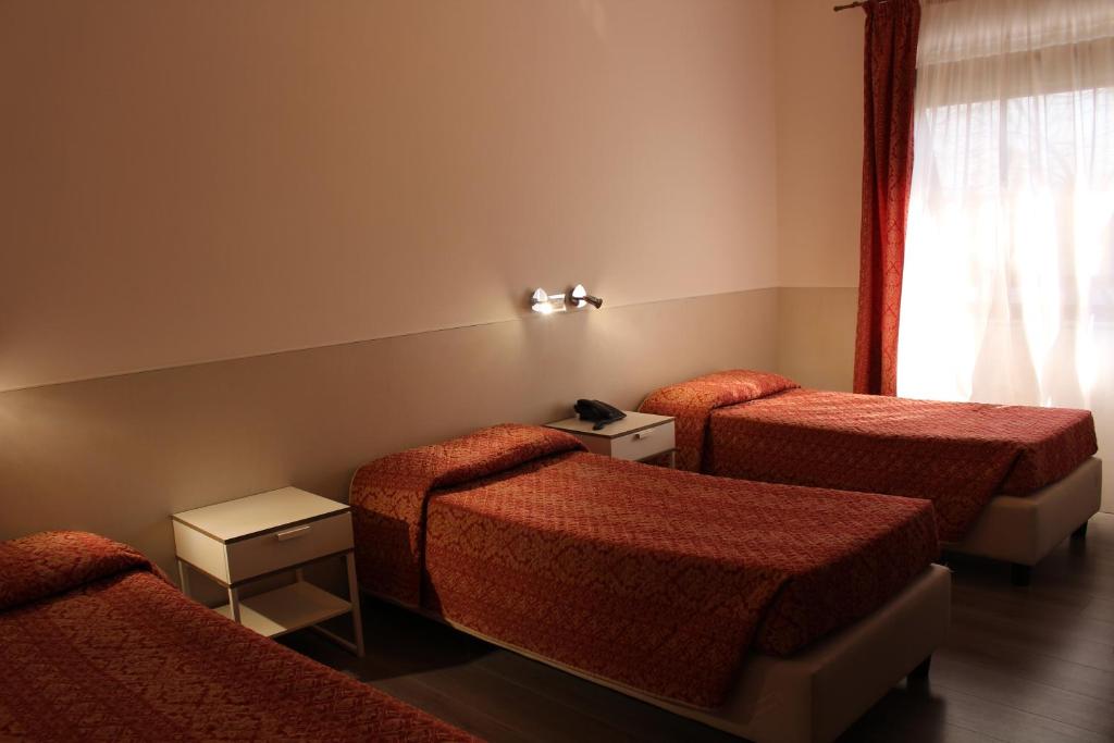 Postel nebo postele na pokoji v ubytování Alla Bianca Hotel
