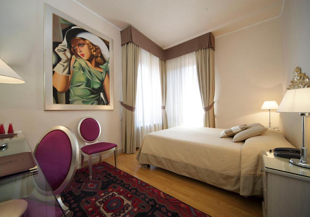 Postel nebo postele na pokoji v ubytování Hotel Liassidi Palace