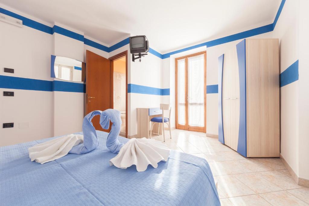 Postel nebo postele na pokoji v ubytování Albergo Belvedere