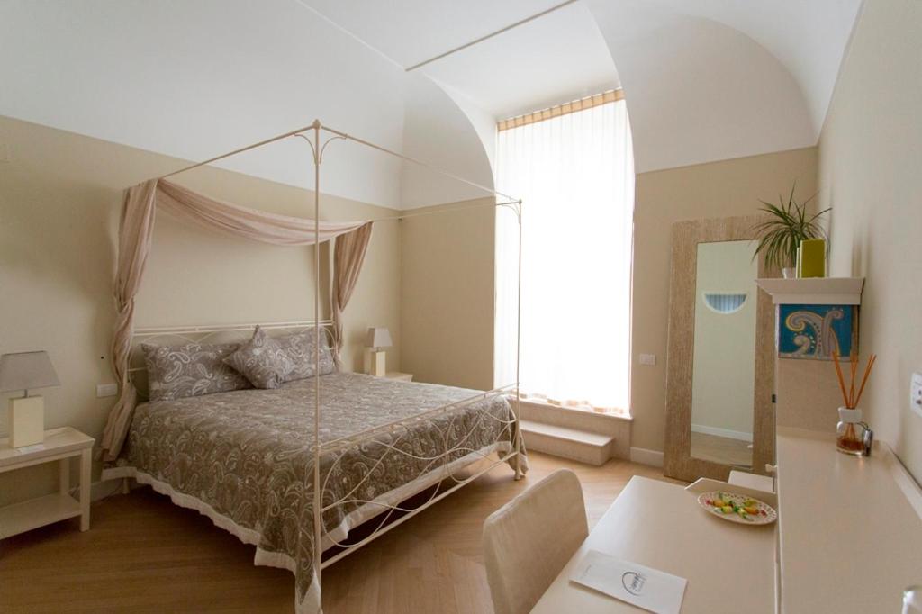 Postel nebo postele na pokoji v ubytování Residenza dei Suoni
