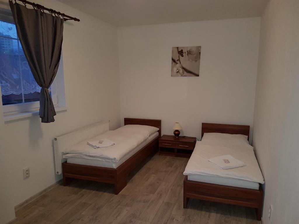 Postel nebo postele na pokoji v ubytování Penzion Maja