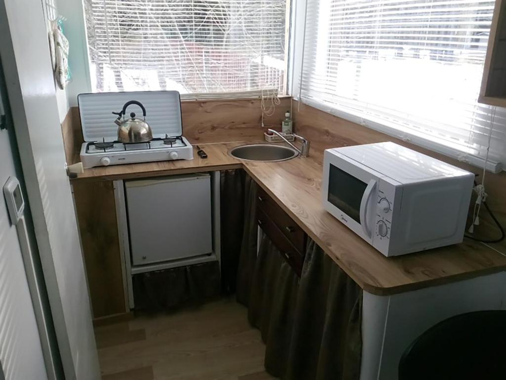 Kuchyň nebo kuchyňský kout v ubytování Koidula Holiday Home