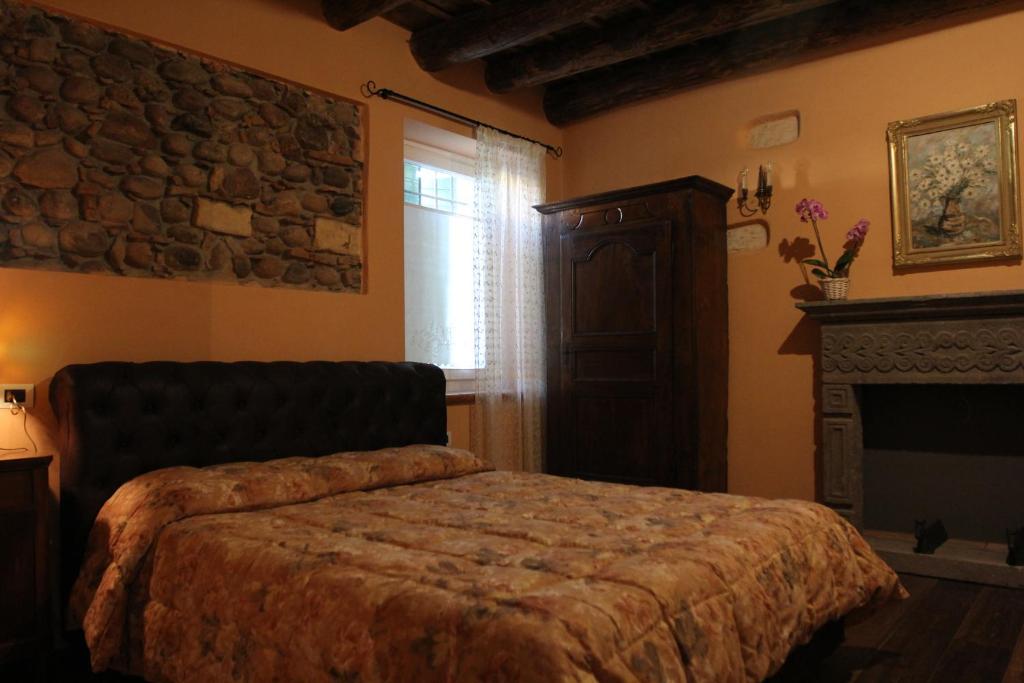 Postel nebo postele na pokoji v ubytování Relais Corte Sant' Agata B&B