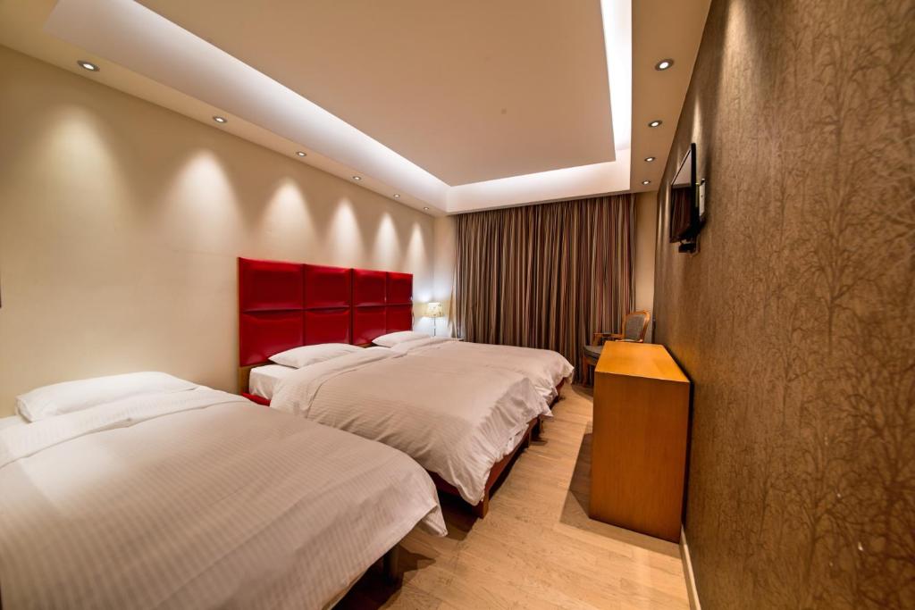 Posteľ alebo postele v izbe v ubytovaní Comfy Boutique Hotel
