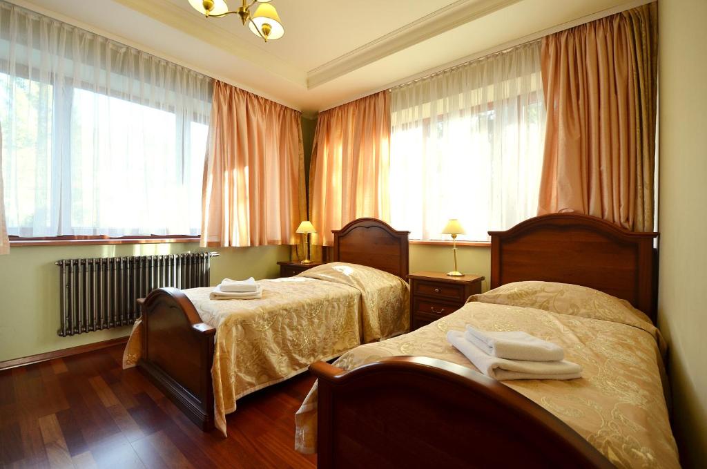Llit o llits en una habitació de Pensjonat Nad Rzeką
