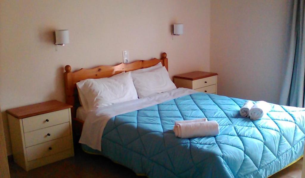 Postel nebo postele na pokoji v ubytování Gorgona apartments & studios