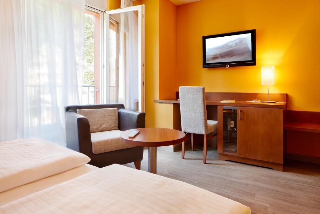 Postel nebo postele na pokoji v ubytování Montfort - das Hotel