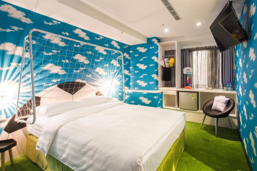 Postel nebo postele na pokoji v ubytování RF Hotel - Sanchong