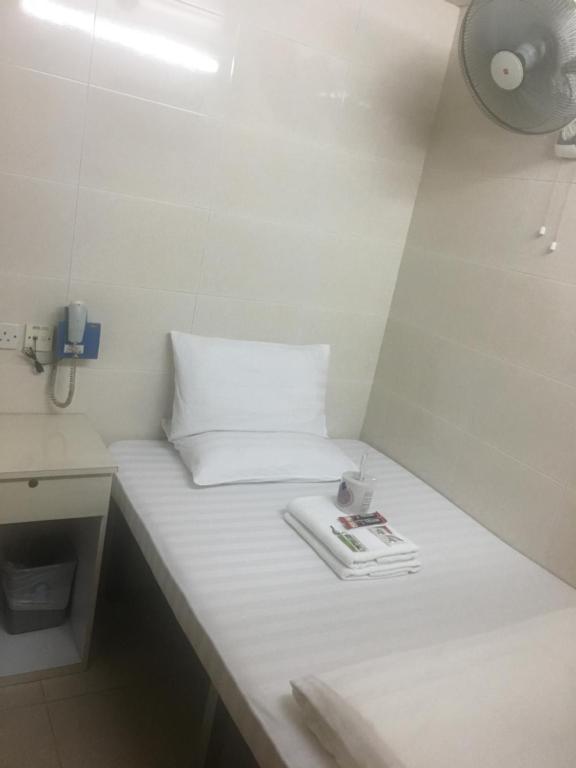 Postel nebo postele na pokoji v ubytování Unique Hostel