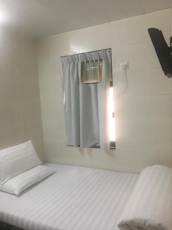 Postel nebo postele na pokoji v ubytování Unique Hostel