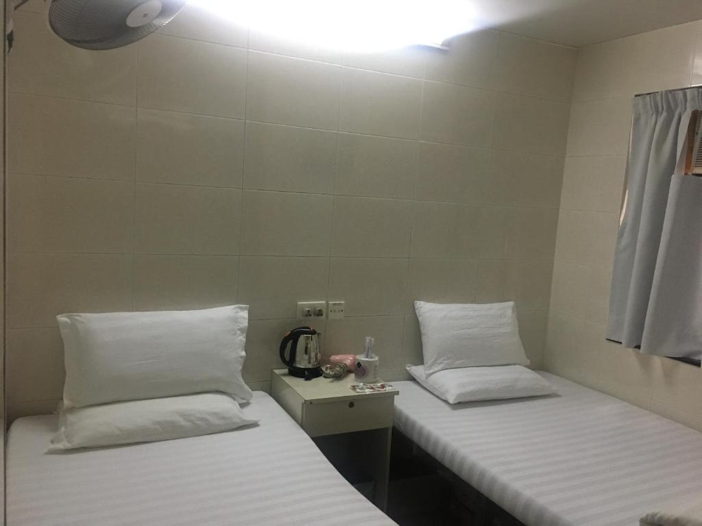 Postel nebo postele na pokoji v ubytování Unique Hostel