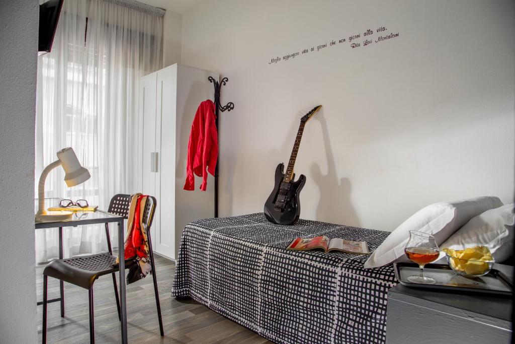 Postel nebo postele na pokoji v ubytování Radio Hotel