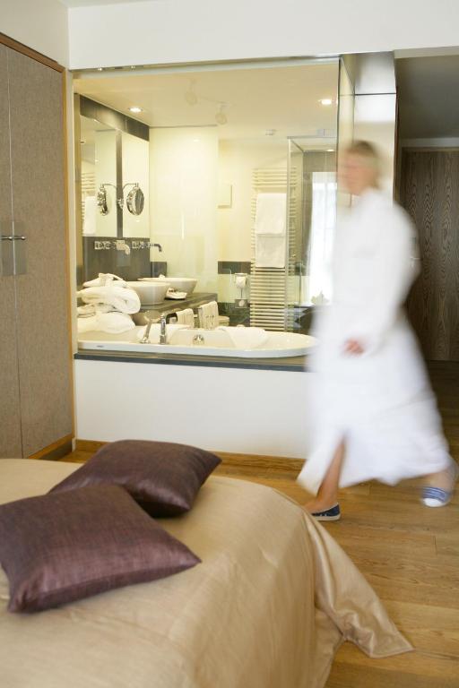 Postel nebo postele na pokoji v ubytování Hotel Maximilian