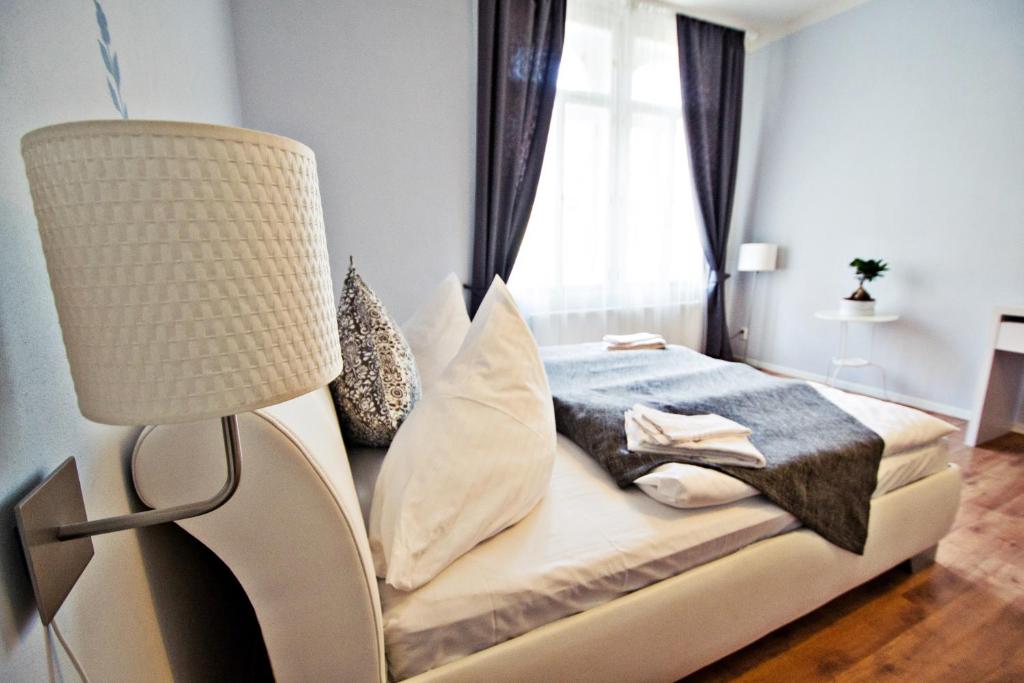 Łóżko lub łóżka w pokoju w obiekcie Business Class Ruterra Suite