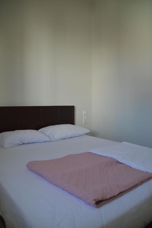 A bed or beds in a room at Christini Apartment