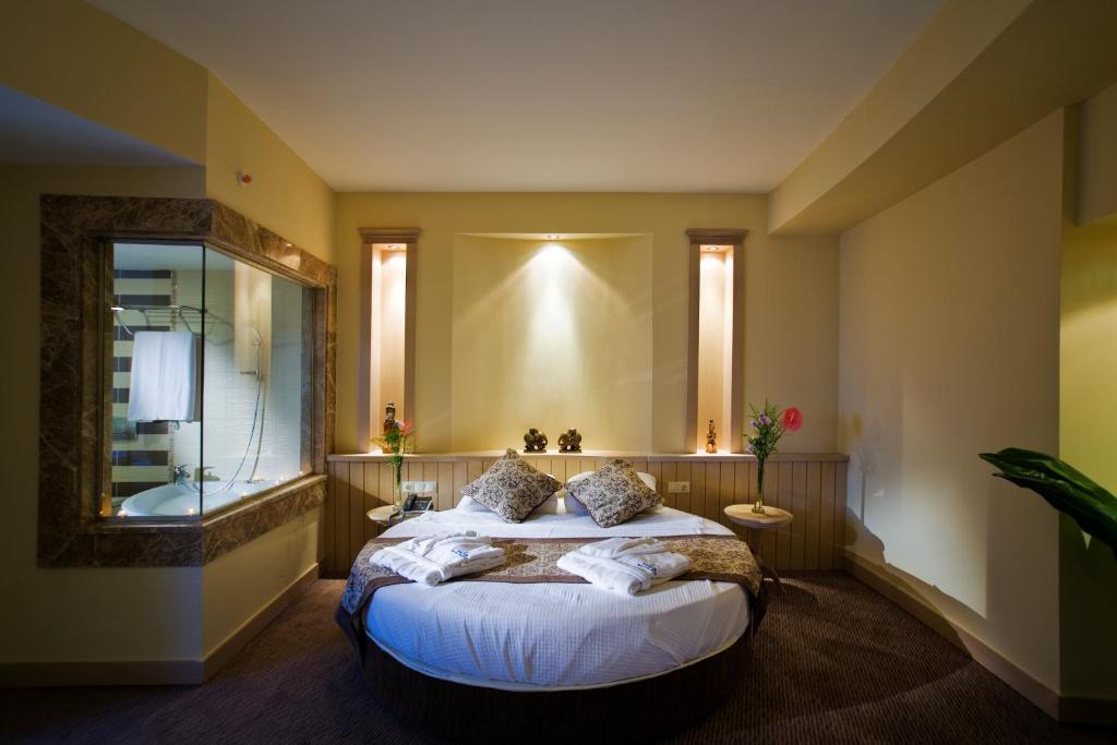 Postel nebo postele na pokoji v ubytování Saphir Resort & Spa