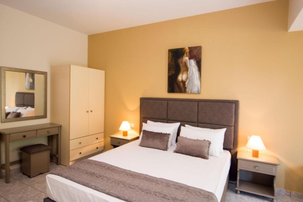 Postel nebo postele na pokoji v ubytování Dina Apartments