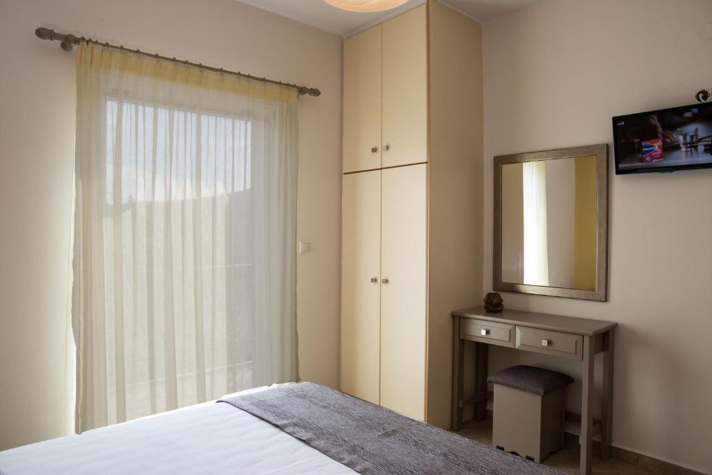 Postel nebo postele na pokoji v ubytování Dina Apartments
