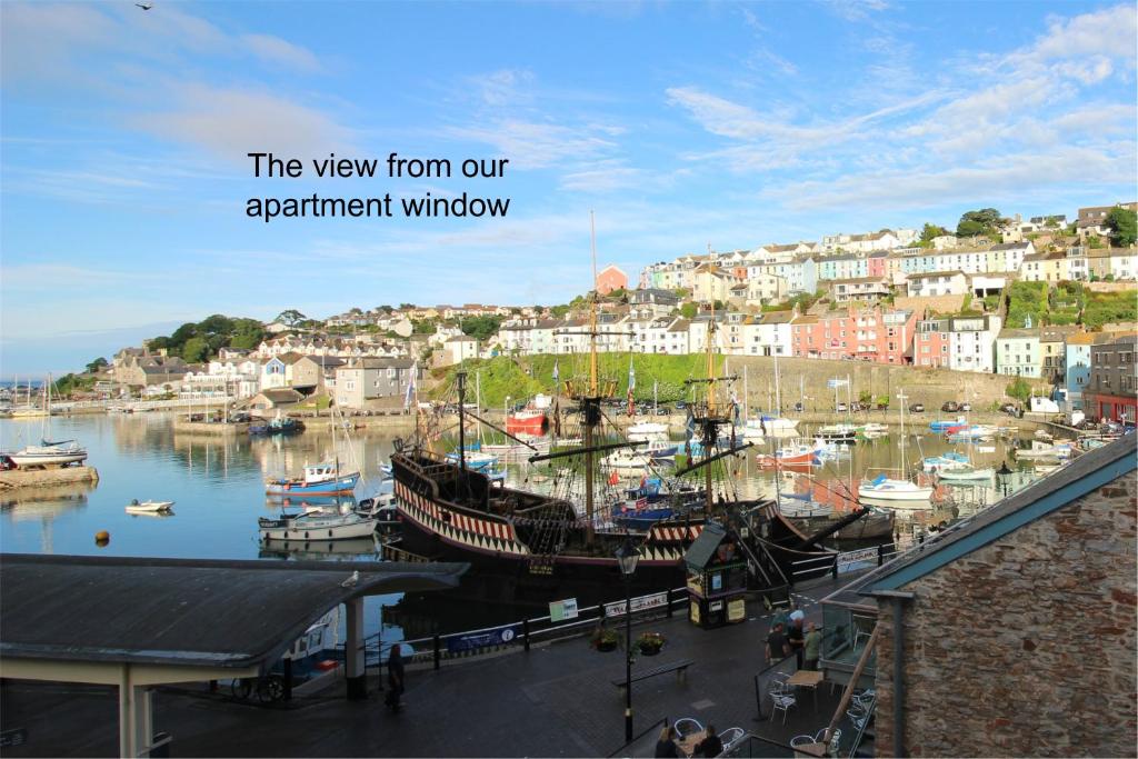 a group of boats are docked in a harbor at One Fisherman's Loft in Brixham