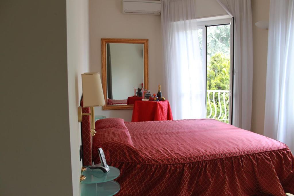 Postel nebo postele na pokoji v ubytování Hotel Il Gatto