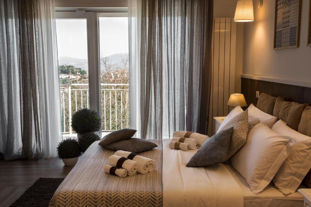 a hotel room with a bed and a window at Residenza il Punto in Perugia
