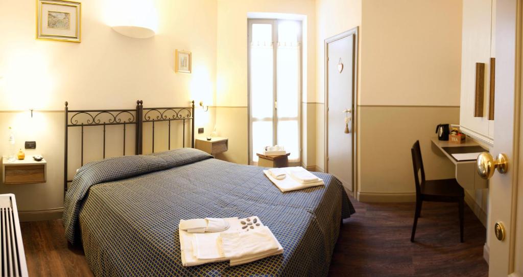 Postel nebo postele na pokoji v ubytování Albergo Benito