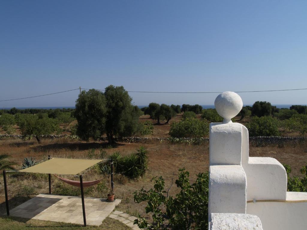 a view from the top of a white building with a garden at Case d'Artista in Savelletri di Fasano