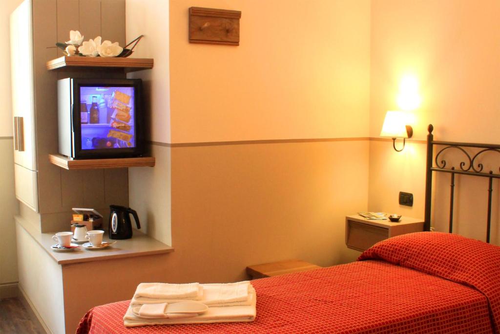 Postel nebo postele na pokoji v ubytování Albergo Benito