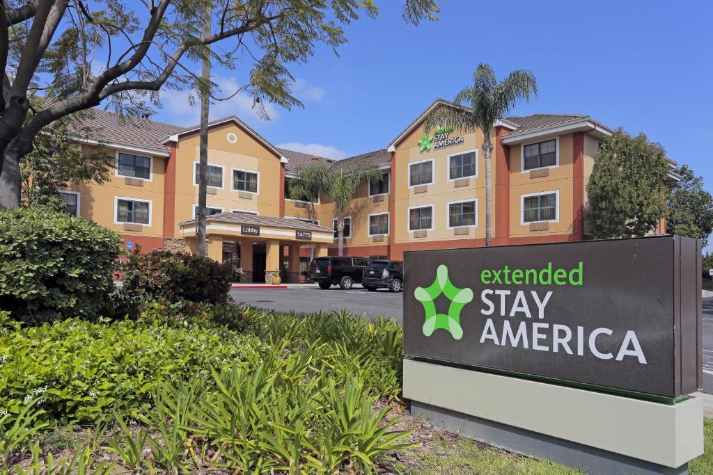 a sign for an extended stay america in front of a building at Extended Stay America Suites - Los Angeles - La Mirada in La Mirada