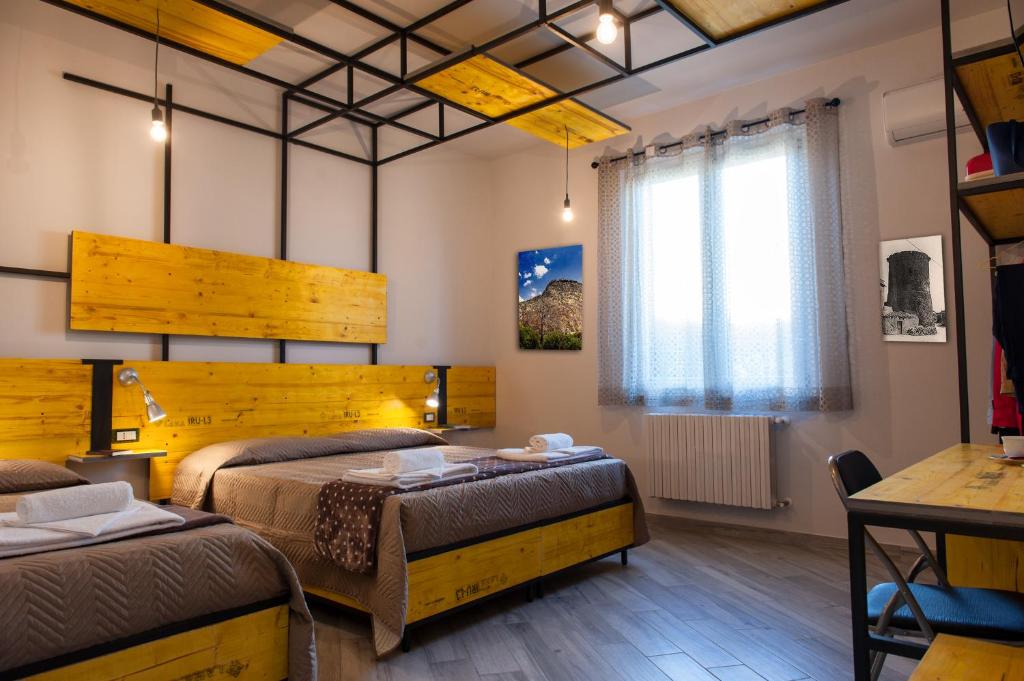 Postel nebo postele na pokoji v ubytování B&B L'Officina di Apollo