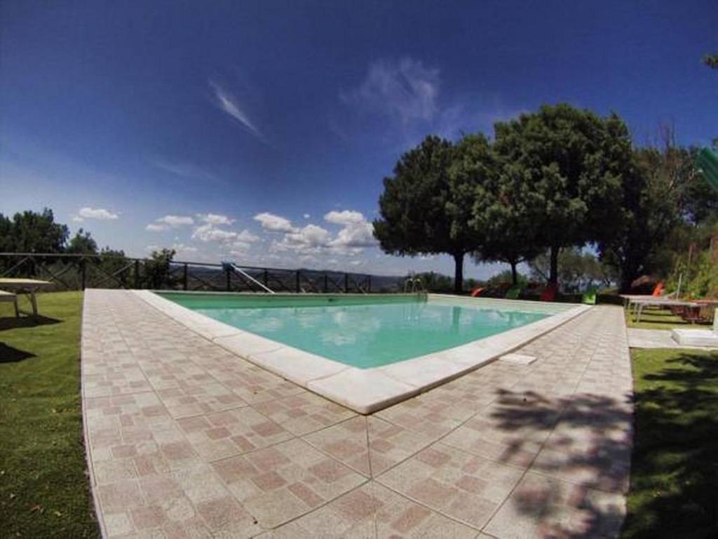 The swimming pool at or close to Il Poggio Delle Ginestre