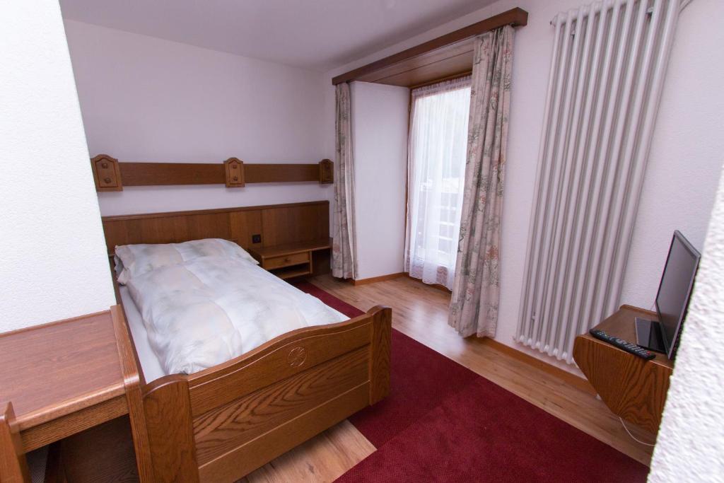 Postel nebo postele na pokoji v ubytování Monte Rosa