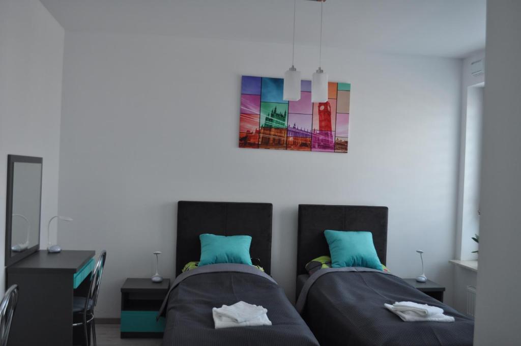 Posteľ alebo postele v izbe v ubytovaní Pop Art Apartments