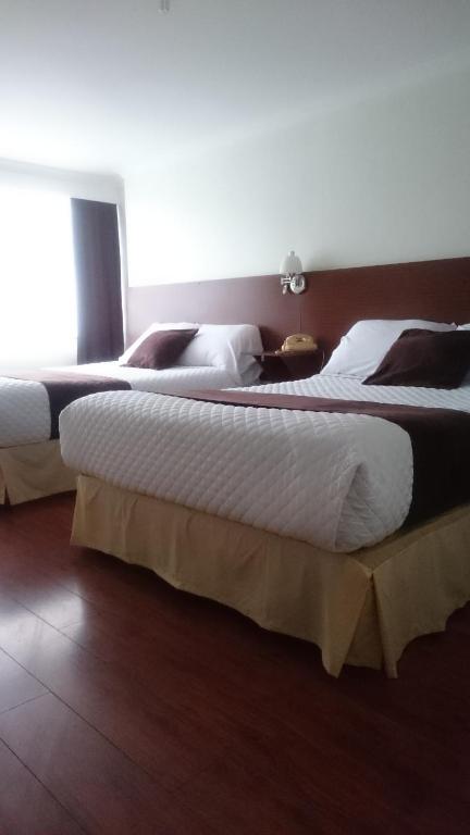 Postel nebo postele na pokoji v ubytování Gran Hotel Napoleón