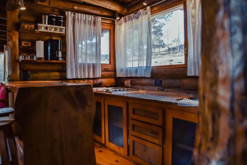 Cabaña con jacuzzi y río cerca de La Cumbrecita