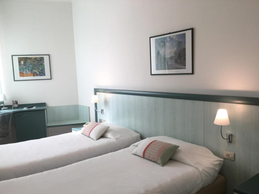 Postel nebo postele na pokoji v ubytování Hotel Europa