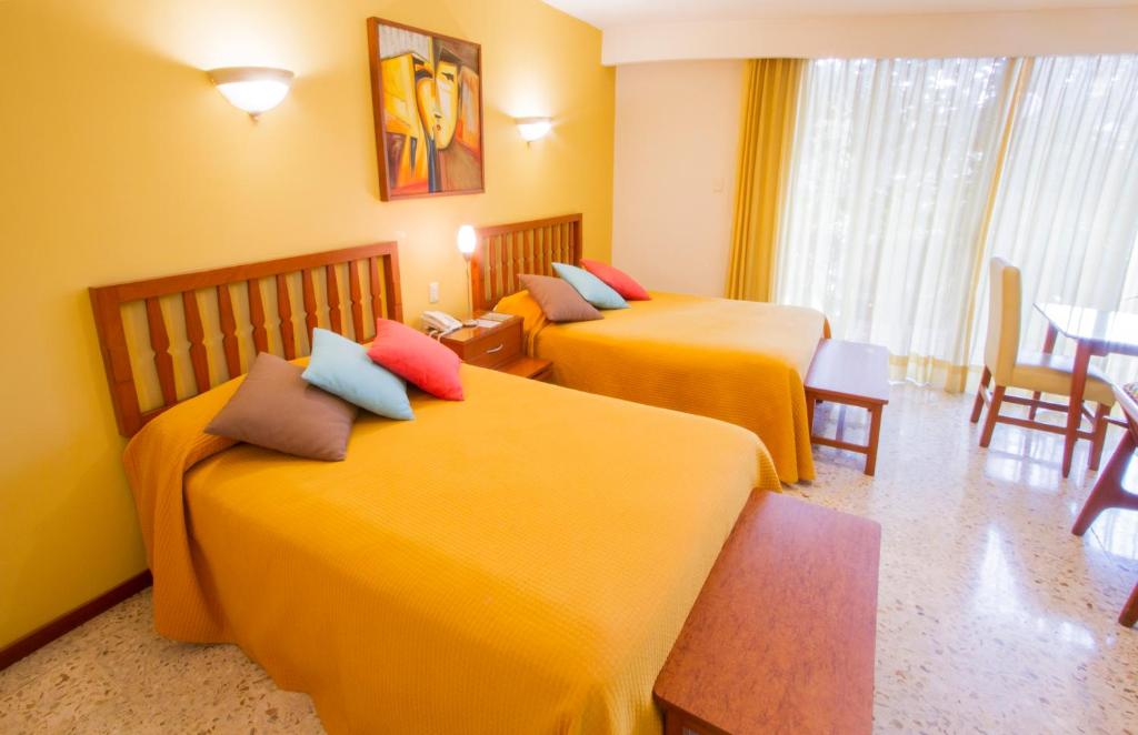 Postel nebo postele na pokoji v ubytování Hotel Posada Loma