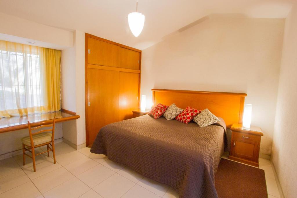 Postel nebo postele na pokoji v ubytování Hotel Posada Loma