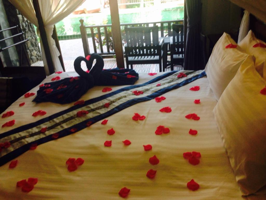 Postel nebo postele na pokoji v ubytování Koh Tao Beach Club