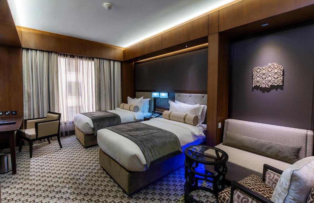 Postel nebo postele na pokoji v ubytování Ayla Grand Hotel