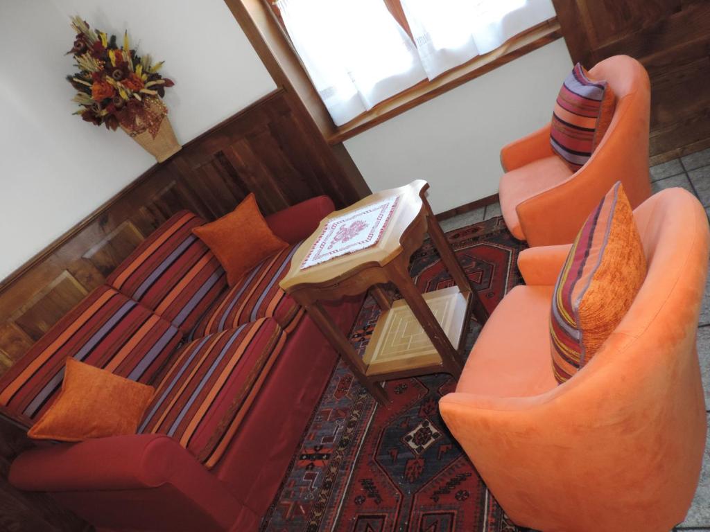 Posezení v ubytování Hotel Le Clocher
