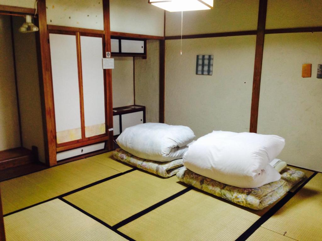 Voodi või voodid majutusasutuse Guest House YAMASHITA-YA toas