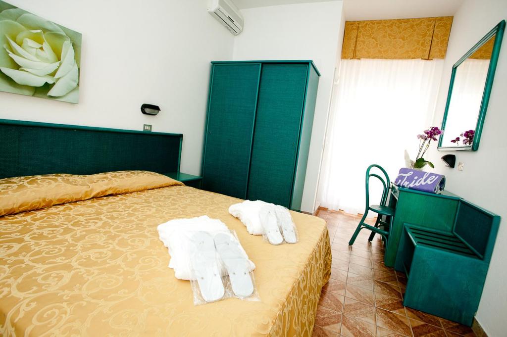 Postel nebo postele na pokoji v ubytování Hotel Iride & Spa