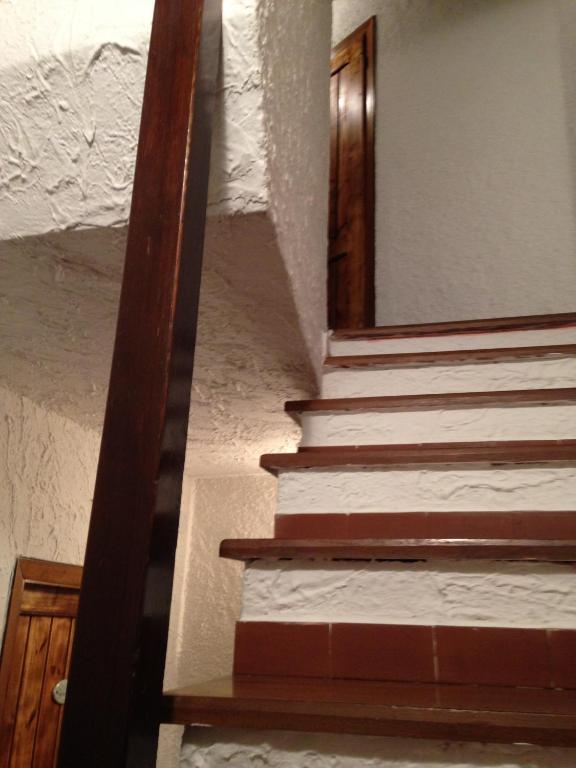 a stairway with a mirror on the wall at il Magàn - Cinque Terre in Corniglia