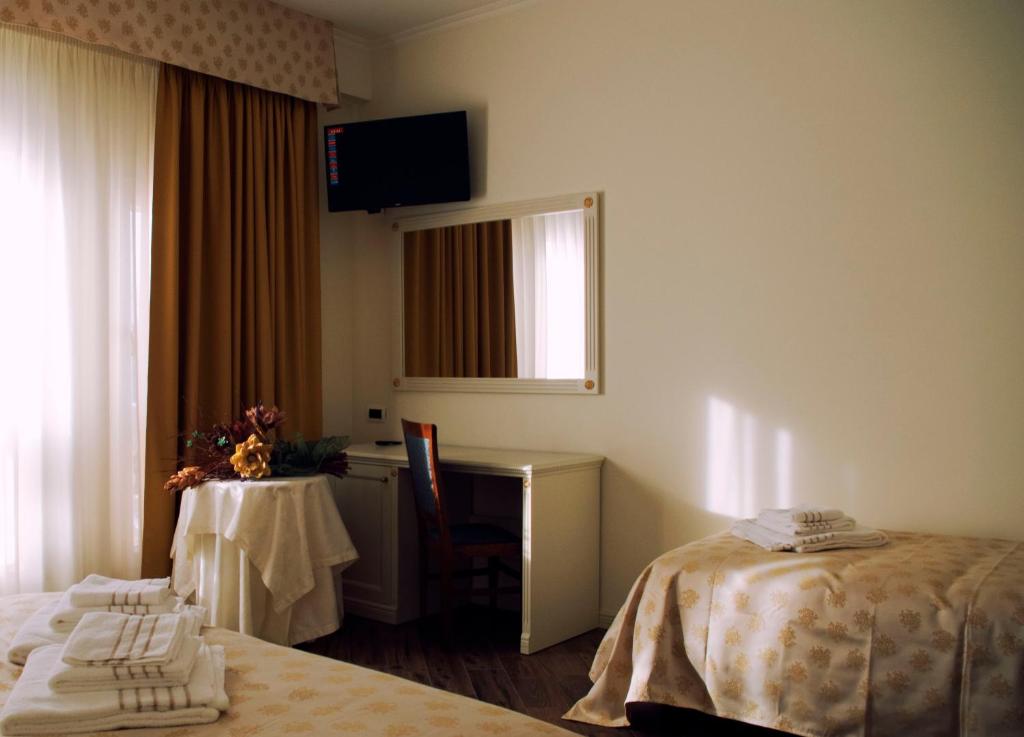 Postel nebo postele na pokoji v ubytování Hotel Colaiaco