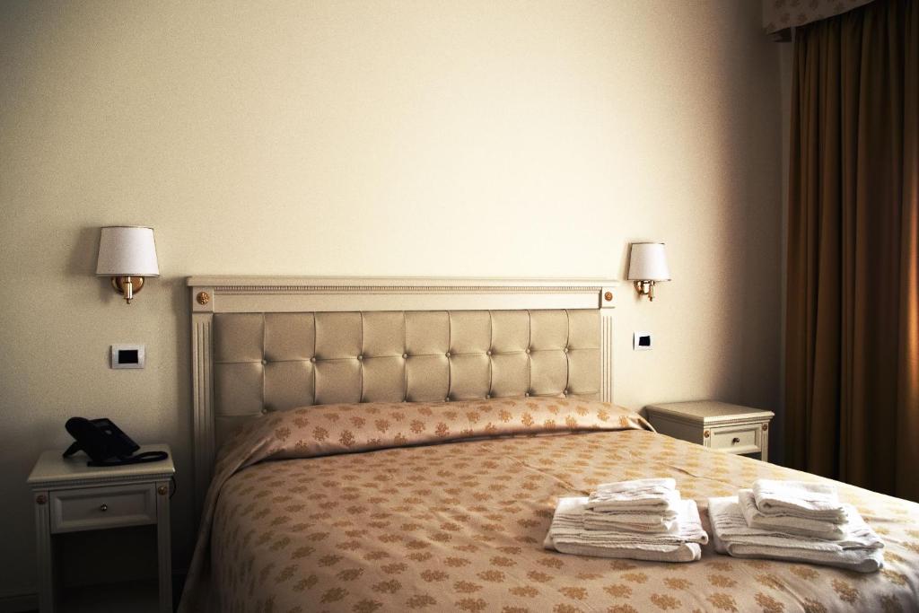 Postel nebo postele na pokoji v ubytování Hotel Colaiaco