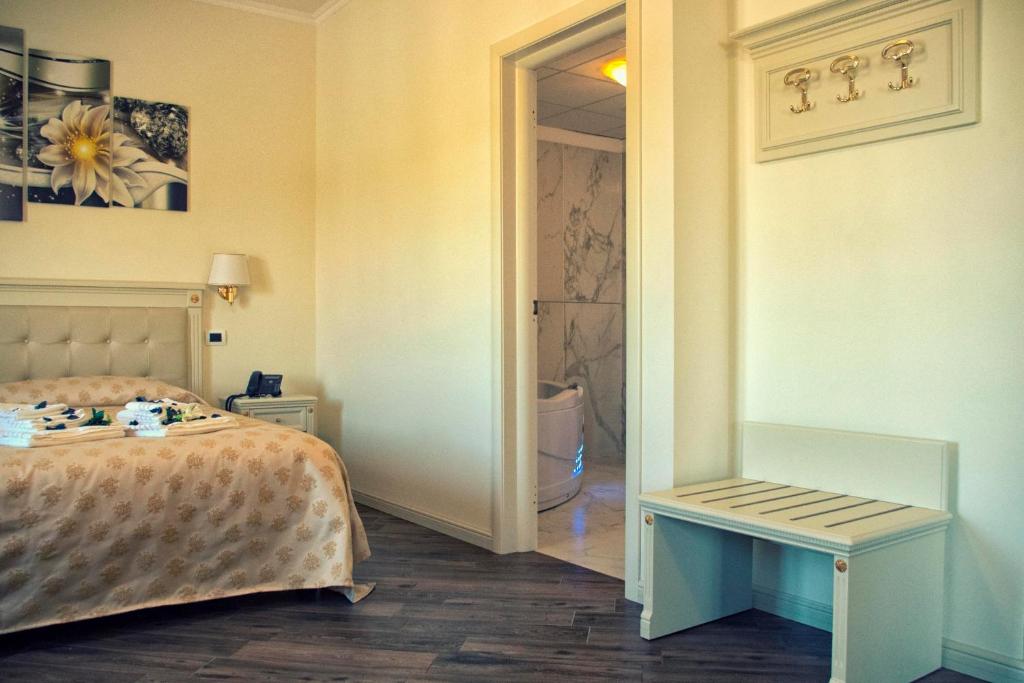 Postel nebo postele na pokoji v ubytování Hotel Colaiaco