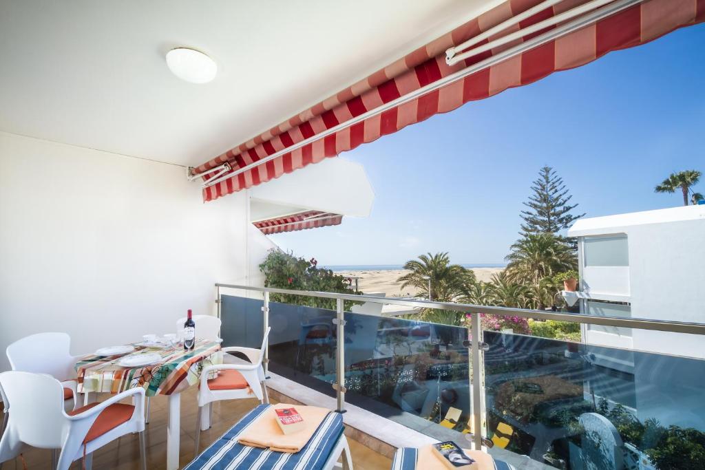 a balcony with a view of the beach at Alsol Patricio in Playa del Ingles